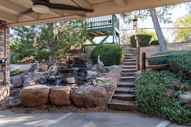 view of yard featuring ceiling fan