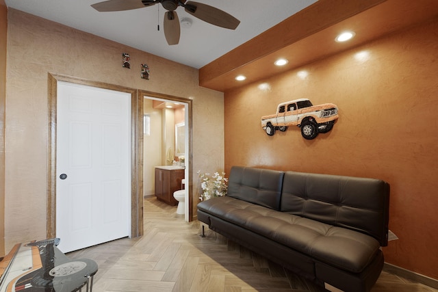 living room featuring ceiling fan and parquet floors