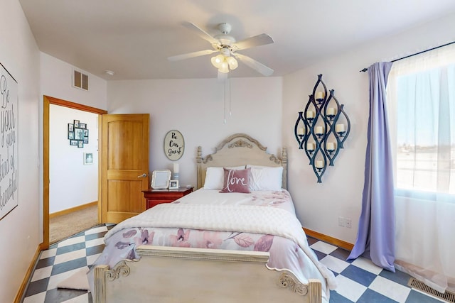 bedroom featuring light carpet and ceiling fan