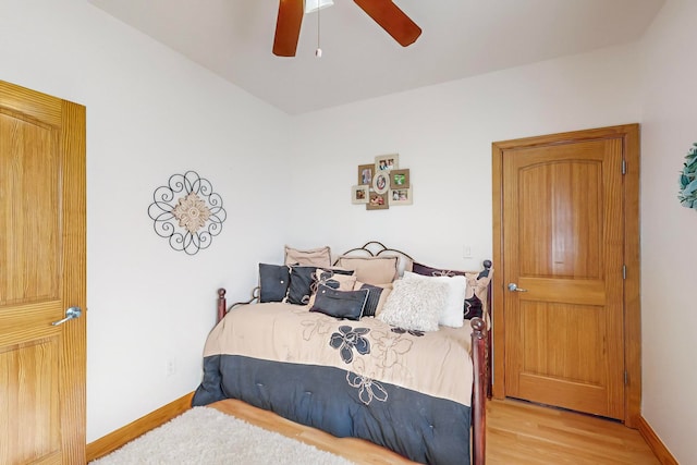 bedroom with ceiling fan and light wood-type flooring