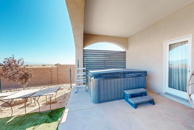 view of patio / terrace featuring a hot tub