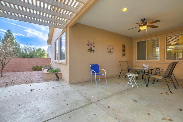 view of patio featuring ceiling fan and a pergola