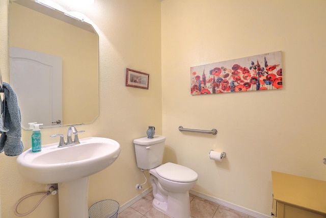 bathroom with tile patterned floors and toilet