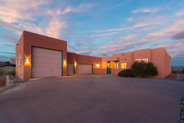 southwest-style home featuring a garage