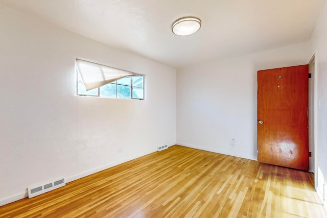 unfurnished room featuring light wood-type flooring