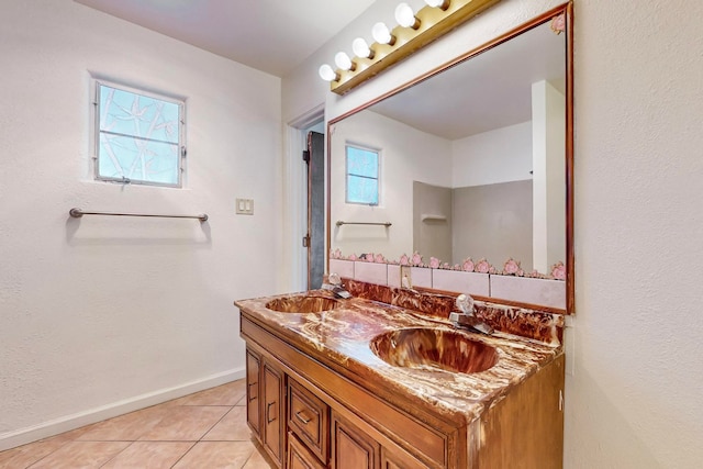 bathroom with tile patterned flooring and vanity