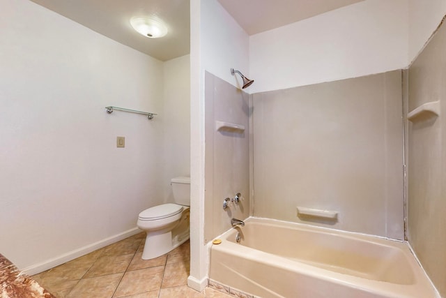 bathroom featuring toilet, tile patterned floors, and tub / shower combination