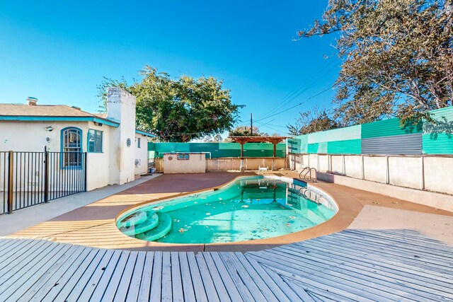 view of swimming pool with a patio