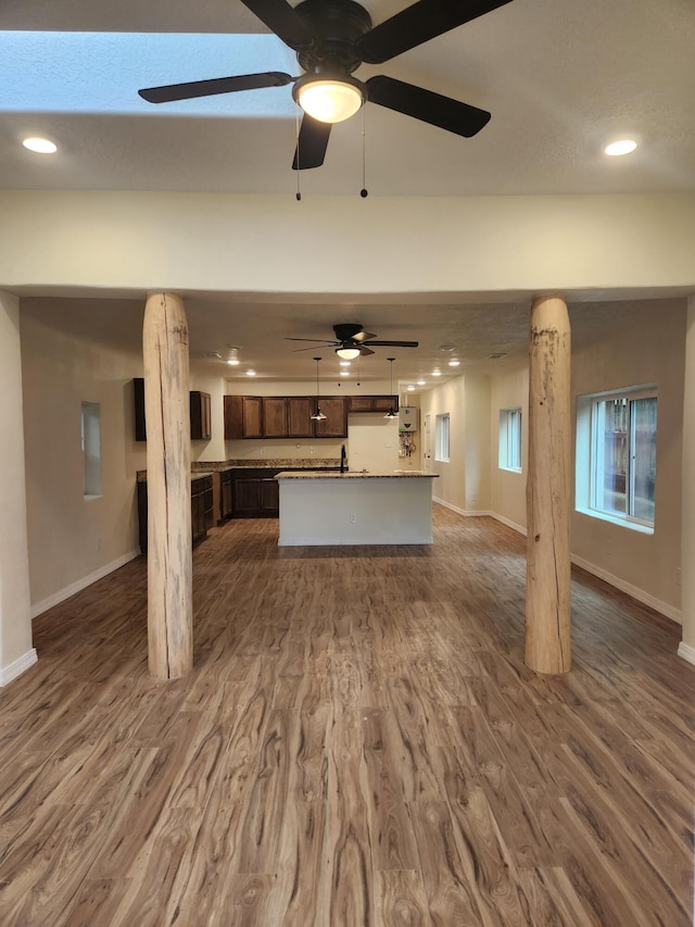 unfurnished living room with dark hardwood / wood-style floors