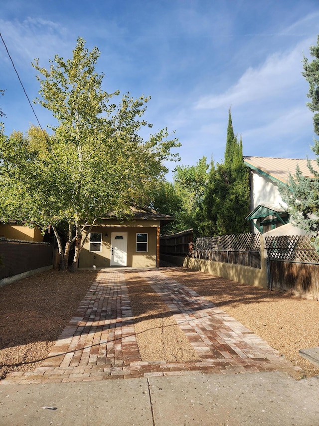 view of property hidden behind natural elements