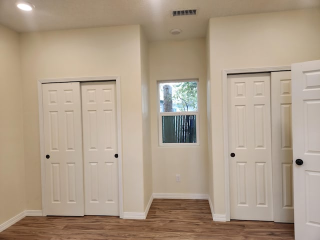 interior space with dark hardwood / wood-style floors