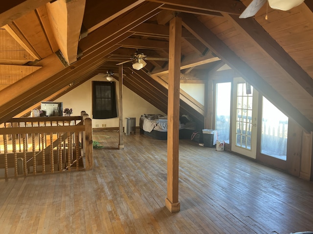 unfinished attic with an upstairs landing