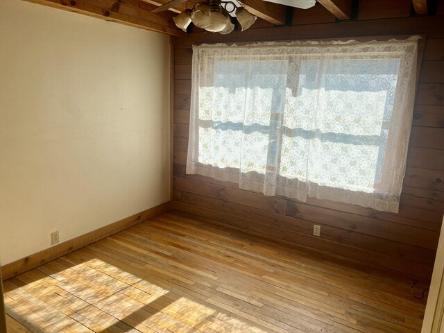 spare room with ceiling fan and light hardwood / wood-style flooring