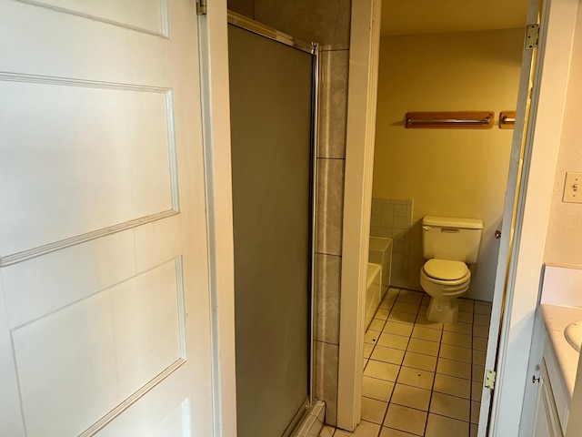 full bathroom featuring shower with separate bathtub, vanity, tile patterned floors, and toilet