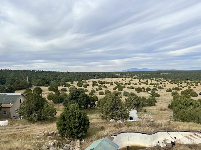 birds eye view of property with a mountain view