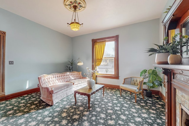 living room with a tile fireplace and carpet flooring