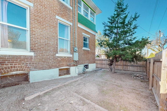 view of side of property featuring a patio