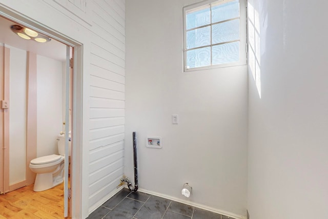 laundry room with washer hookup and dark hardwood / wood-style floors