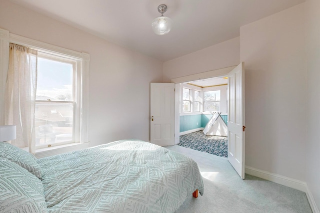 bedroom featuring light carpet