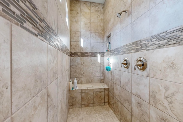 bathroom featuring a tile shower