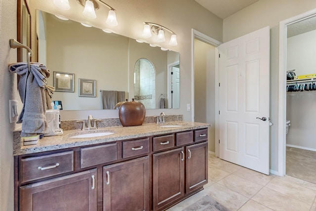 bathroom with vanity and tile patterned floors