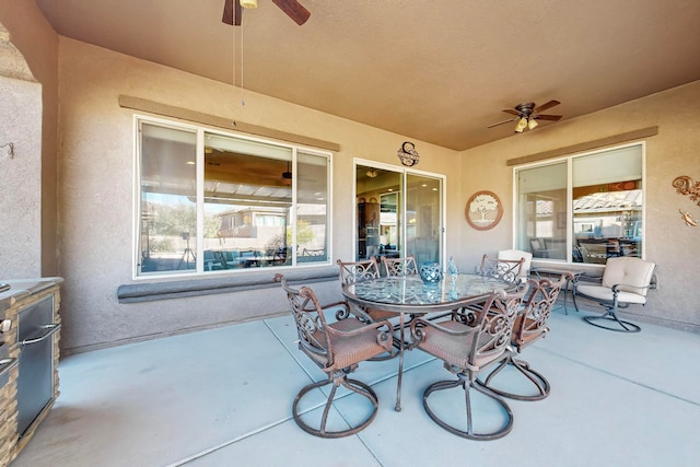 view of patio featuring ceiling fan