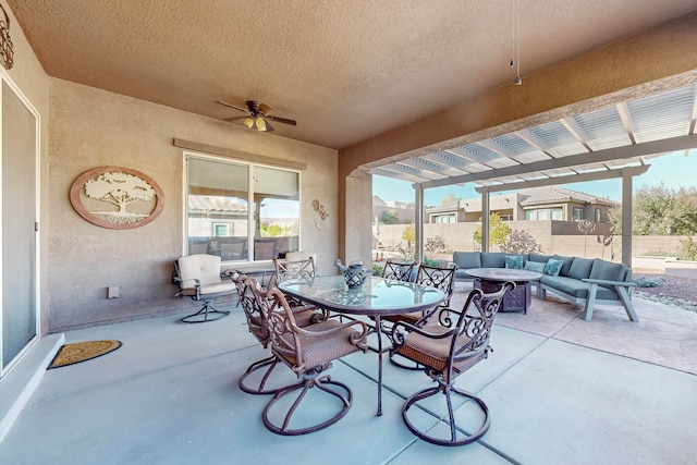 view of patio / terrace with outdoor lounge area, ceiling fan, and a pergola