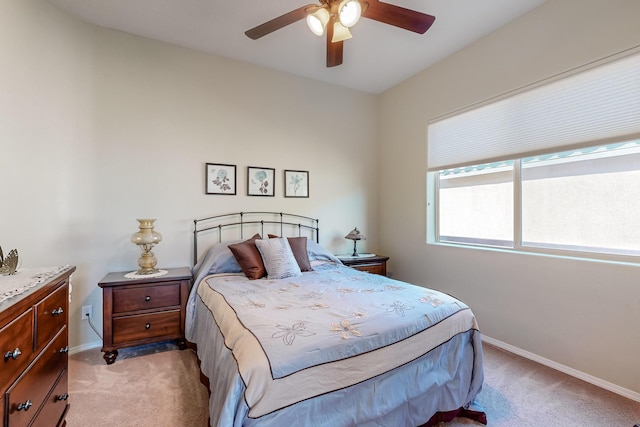 bedroom with light colored carpet and ceiling fan