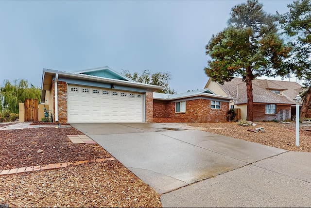 ranch-style home featuring a garage