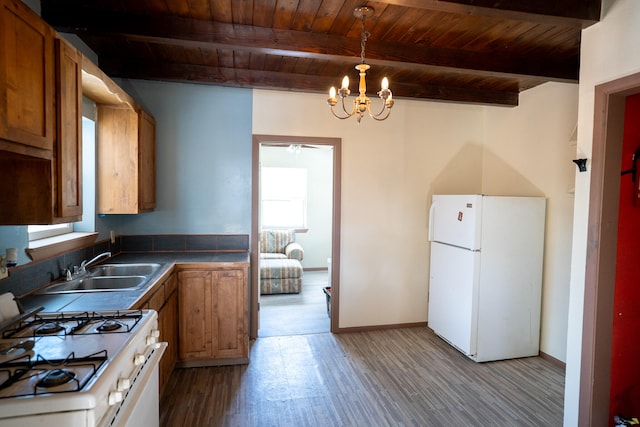 kitchen with light hardwood / wood-style floors, white refrigerator, range, beam ceiling, and decorative light fixtures