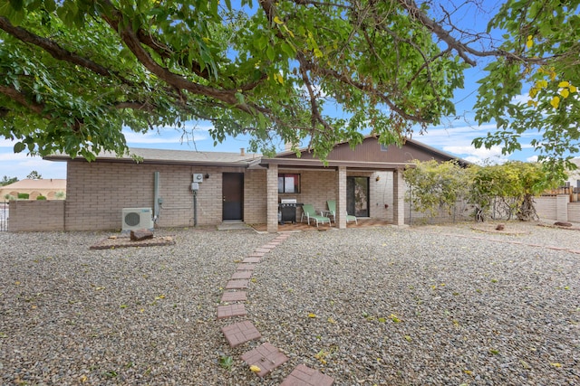 back of house with a patio and ac unit