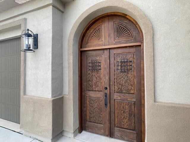 doorway to property featuring a garage