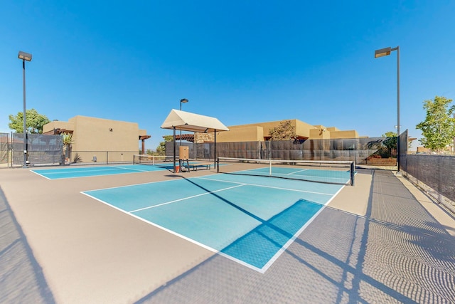 view of sport court featuring basketball hoop