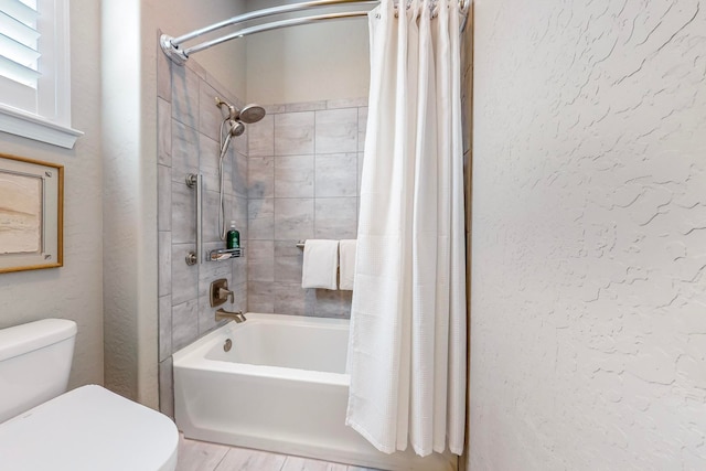 bathroom with toilet, shower / bath combo with shower curtain, and hardwood / wood-style flooring