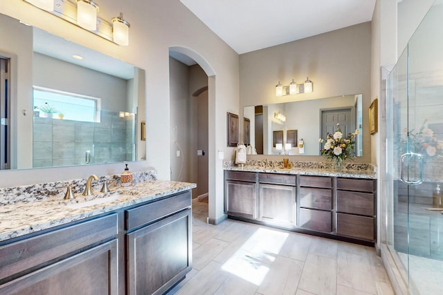 bathroom with an enclosed shower and vanity