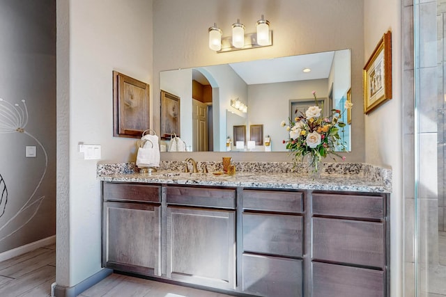 bathroom featuring hardwood / wood-style floors and vanity