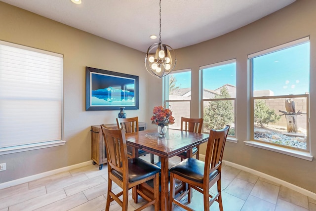 dining area featuring a notable chandelier