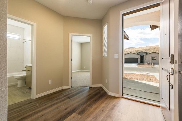 doorway to outside featuring dark hardwood / wood-style floors