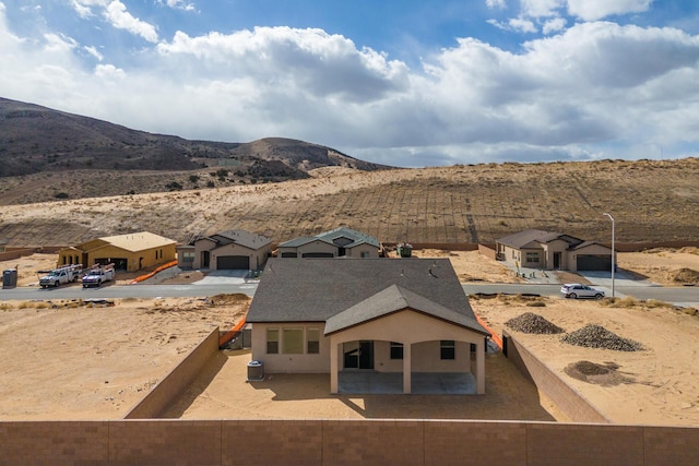 exterior space featuring cooling unit and a mountain view