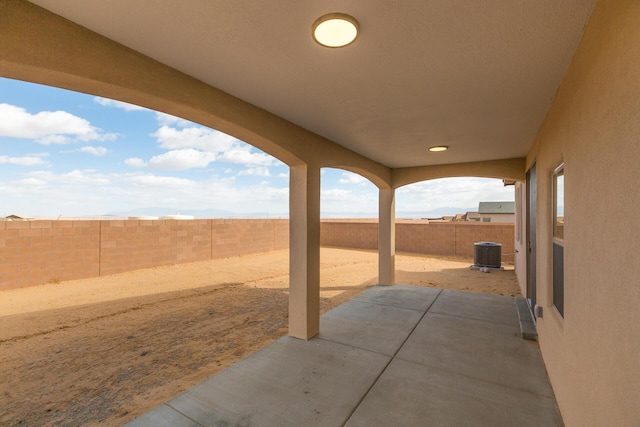 4860 Guadalupe Peak St SW, Los Lunas, NM 87031 - view of patio / terrace with a fenced backyard and cooling unit