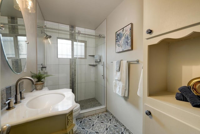 bathroom with tile patterned flooring, vanity, and an enclosed shower