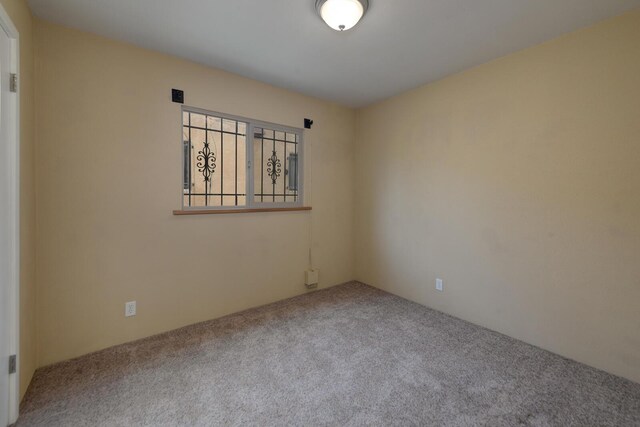 unfurnished room featuring carpet flooring