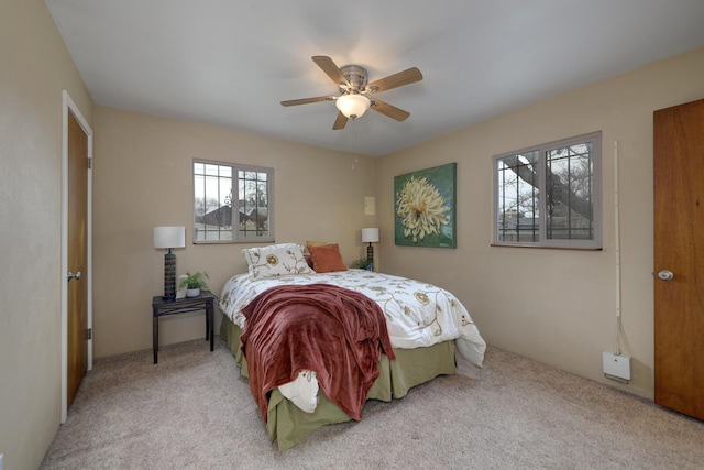 bedroom featuring ceiling fan and carpet floors