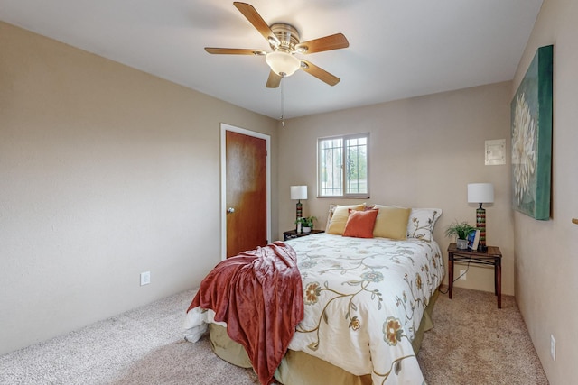 bedroom featuring ceiling fan and light colored carpet