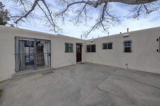 rear view of house featuring a patio