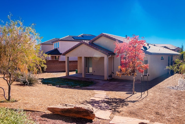 back of house with a patio area