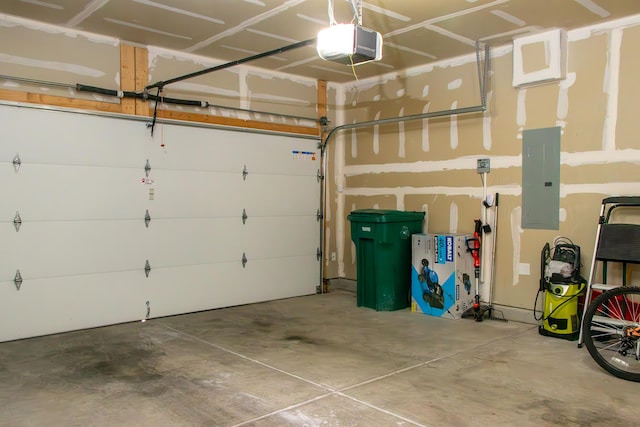 garage featuring electric panel and a garage door opener