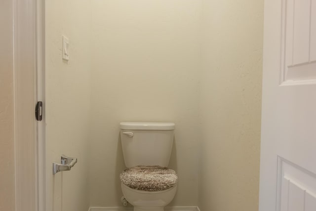 bathroom featuring toilet