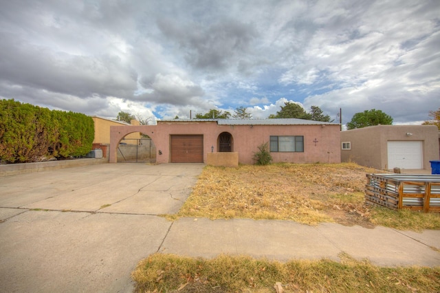 adobe home featuring a garage