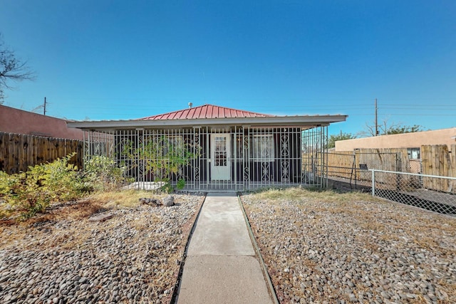 view of front of home featuring a carport